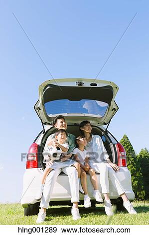 Happy Japanese family with car in a city park View Large Photo Image Stock Photo - Happy Japanese family with car in a city park. Fotosearch
