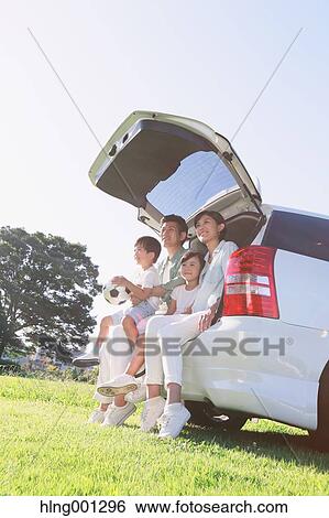 Happy Japanese family with car in a city park View Large Photo Image Stock Photograph - Happy Japanese family with car in a city park. Fotosearch