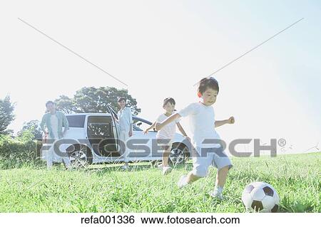 Happy Japanese family with car in a city park View Large Photo Image Stock Photograph - Happy Japanese family with car in a city park. Fotosearch