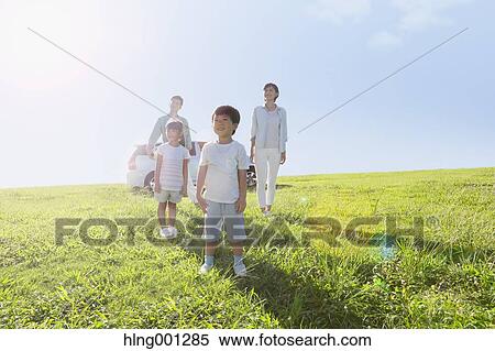 Happy Japanese family with car in a city park View Large Photo Image Stock Photography - Happy Japanese family with car in a city park. Fotosearch