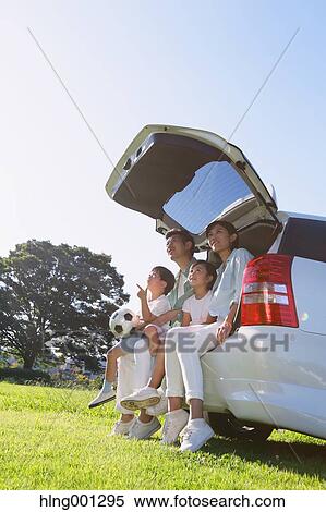 Happy Japanese family with car in a city park View Large Photo Image Stock Photography - Happy Japanese family with car in a city park. Fotosearch