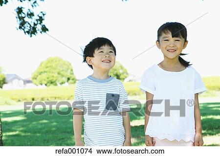 Happy Japanese kids in a city park View Large Photo Image Picture - Happy Japanese kids in a city park. Fotosearch