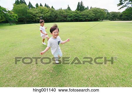 Happy Japanese kids in a city park View Large Photo Image Stock Image - Happy Japanese kids in a city park. Fotosearch