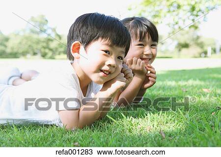 Happy Japanese kids in a city park View Large Photo Image Stock Image - Happy Japanese kids in a city park. Fotosearch