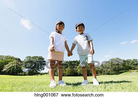 Happy Japanese kids in a city park View Large Photo Image Stock Photo - Happy Japanese kids in a city park. Fotosearch