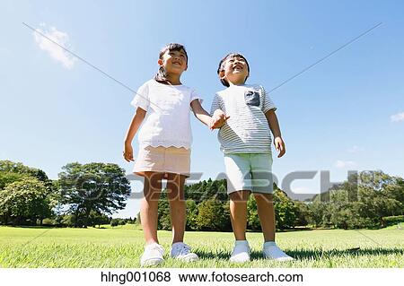 Stock Photo - Happy Japanese kids in a city park. Fotosearch