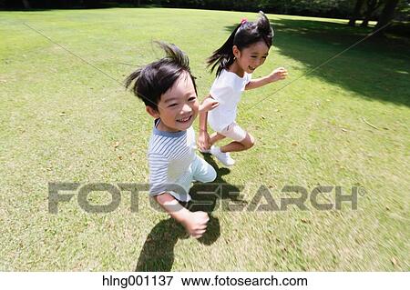 Happy Japanese kids in a city park View Large Photo Image Stock Photo - Happy Japanese kids in a city park. Fotosearch