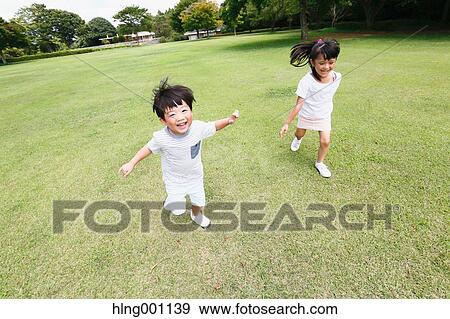 Happy Japanese kids in a city park View Large Photo Image Stock Photo - Happy Japanese kids in a city park. Fotosearch