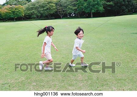 Happy Japanese kids in a city park View Large Photo Image Stock Photograph - Happy Japanese kids in a city park. Fotosearch
