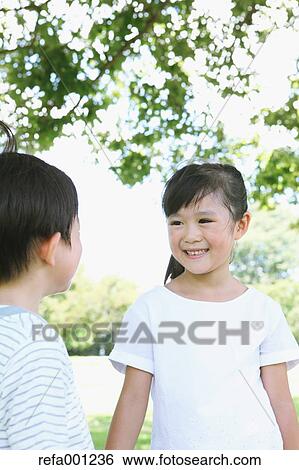 Happy Japanese kids in a city park View Large Photo Image Stock Photograph - Happy Japanese kids in a city park. Fotosearch