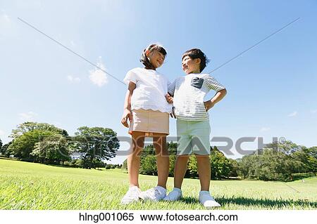 Stock Photography - Happy Japanese kids in a city park. Fotosearch