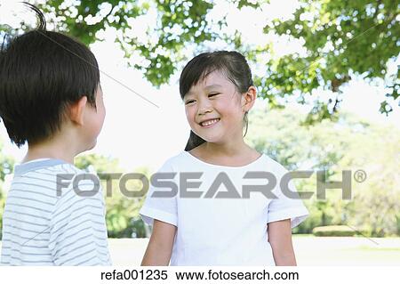 Happy Japanese kids in a city park View Large Photo Image Stock Photography - Happy Japanese kids in a city park. Fotosearch