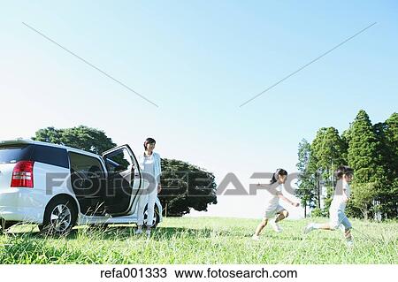Japanese family with car in a city park View Large Photo Image Stock Image - Japanese family with car in a city park. Fotosearch