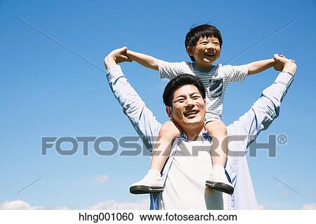 Japanese father and son laughing View Large Photo Image Stock Image - Japanese father and son laughing. Fotosearch