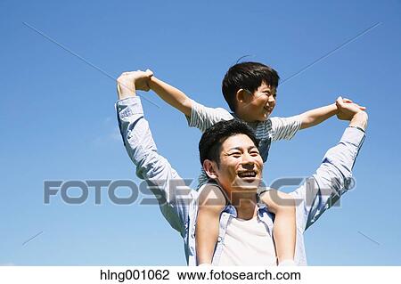 Japanese father and son laughing View Large Photo Image Stock Image - Japanese father and son laughing. Fotosearch
