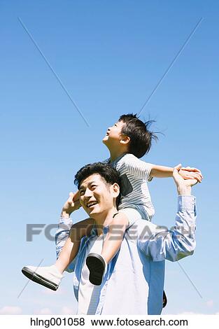 Japanese father and son laughing View Large Photo Image Stock Photo - Japanese father and son laughing. Fotosearch