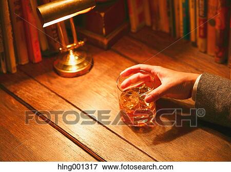 Japanese man with glass of whiskey in a fashionable bar View Large Photo Image Stock Photo - Japanese man with glass of whiskey in a fashionable bar. Fotosearch