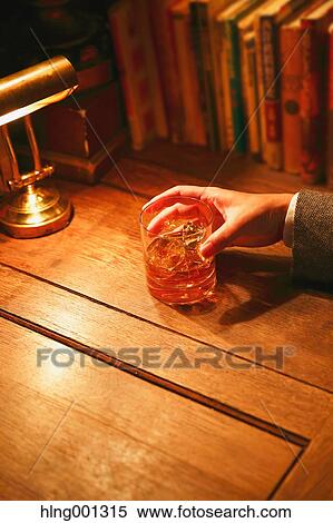 Japanese man with glass of whiskey in a fashionable bar View Large Photo Image Stock Photography - Japanese man with glass of whiskey in a fashionable bar. Fotosearch