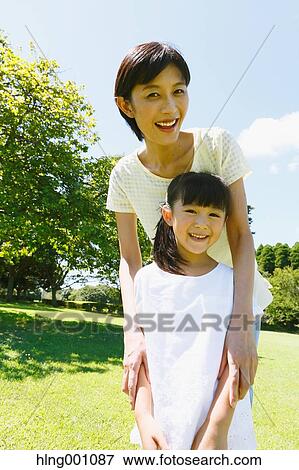 Japanese mother and daughter in a city park View Large Photo Image Stock Photo - Japanese mother and daughter in a city park. Fotosearch