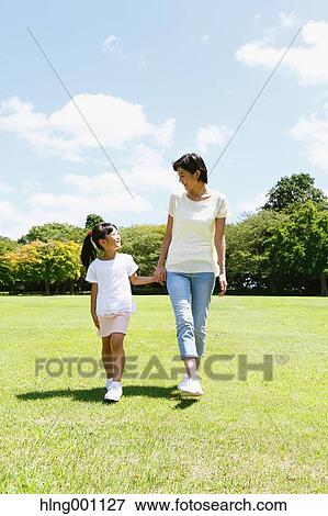 Japanese mother and daughter in a city park View Large Photo Image Stock Photo - Japanese mother and daughter in a city park. Fotosearch