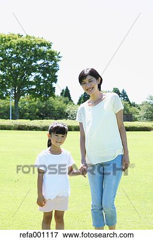 Japanese mother and daughter in a city park View Large Photo Image Stock Photo - Japanese mother and daughter in a city park. Fotosearch