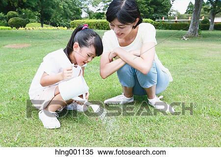 Japanese mother and daughter in a city park View Large Photo Image Stock Photography - Japanese mother and daughter in a city park. Fotosearch