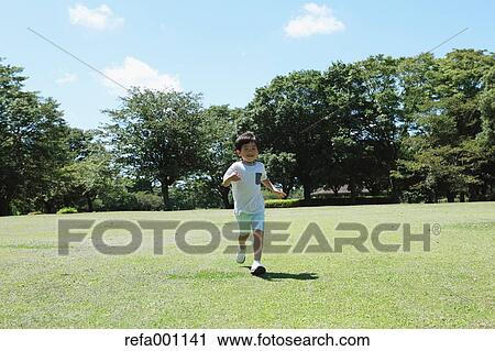 Japanese young boy in a city park View Large Photo Image Stock Image - Japanese young boy in a city park. Fotosearch