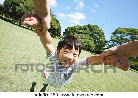 Japanese young boy in a city park View Large Photo Image Stock Image - Japanese young boy in a city park. Fotosearch