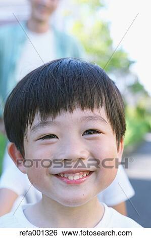Japanese young boy in a city park View Large Photo Image Stock Photograph - Japanese young boy in a city park. Fotosearch