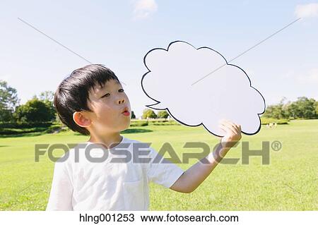 Japanese young boy with whiteboard in a city park View Large Photo Image Stock Image - Japanese young boy with whiteboard in a city park. Fotosearch