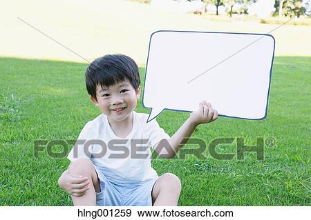 Japanese young boy with whiteboard in a city park View Large Photo Image Stock Photo - Japanese young boy with whiteboard in a city park. Fotosearch