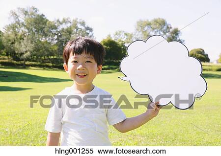 Japanese young boy with whiteboard in a city park View Large Photo Image Stock Photography - Japanese young boy with whiteboard in a city park. Fotosearch