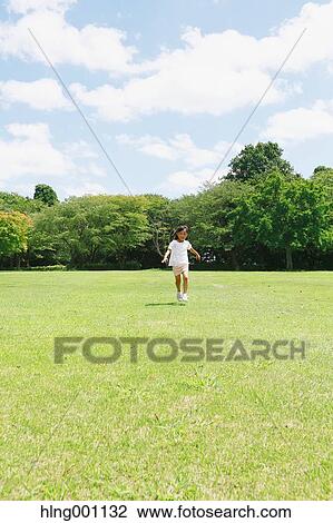 Japanese young girl in a city park View Large Photo Image Stock Image - Japanese young girl in a city park. Fotosearch
