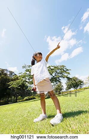 Japanese young girl with binoculars in a city park View Large Photo Image Stock Image - Japanese young girl with binoculars in a city park. Fotosearch