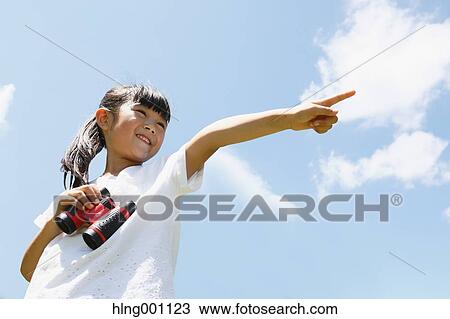 Japanese young girl with binoculars in a city park View Large Photo Image Stock Image - Japanese young girl with binoculars in a city park. Fotosearch