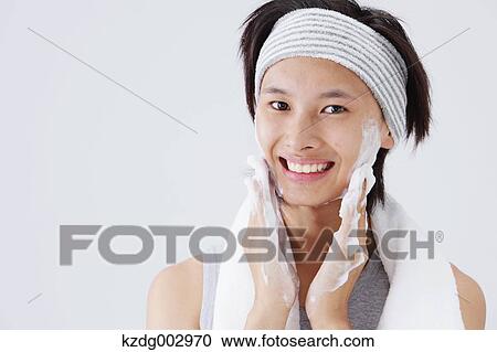 Portrait of young man doing skin care View Large Photo Image Stock Image - Portrait of young man doing skin care. Fotosearch