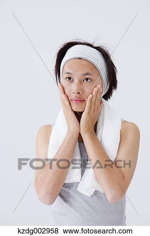 Stock Photo - Portrait of young man doing skin care. Fotosearch