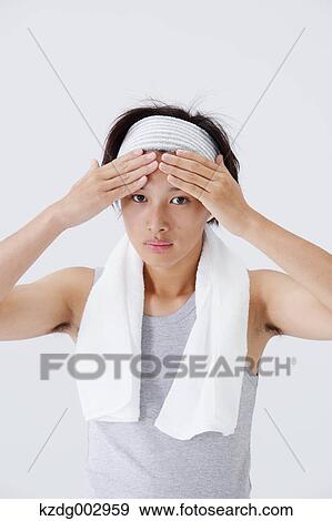 Stock Photo - Portrait of young man doing skin care. Fotosearch
