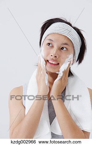 Portrait of young man doing skin care View Large Photo Image Stock Photograph - Portrait of young man doing skin care. Fotosearch