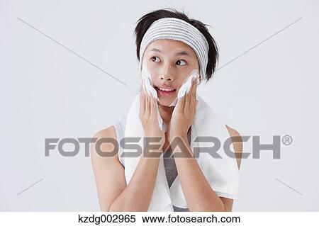 Portrait of young man doing skin care View Large Photo Image Stock Photography - Portrait of young man doing skin care. Fotosearch