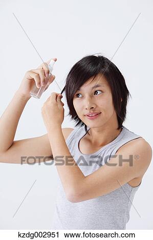 Portrait of young man using moisture View Large Photo Image Stock Image - Portrait of young man using moisture. Fotosearch