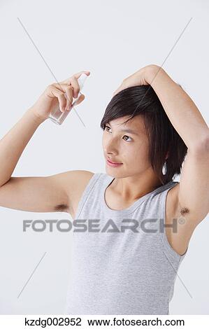 Portrait of young man using moisture View Large Photo Image Stock Image - Portrait of young man using moisture. Fotosearch