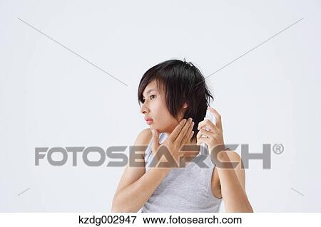 Portrait of young man using moisture View Large Photo Image Stock Photo - Portrait of young man using moisture. Fotosearch