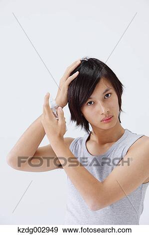 Stock Photo - Portrait of young man using moisture. Fotosearch