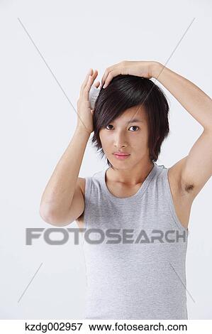 Portrait of young man using moisture View Large Photo Image Stock Photo - Portrait of young man using moisture. Fotosearch