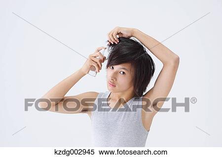 Portrait of young man using moisture View Large Photo Image Stock Photography - Portrait of young man using moisture. Fotosearch