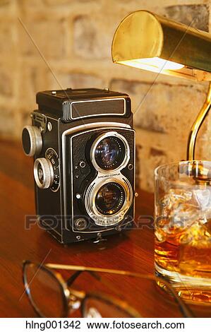 Whiskey and vintage camera View Large Photo Image Stock Image - Whiskey and vintage camera. Fotosearch