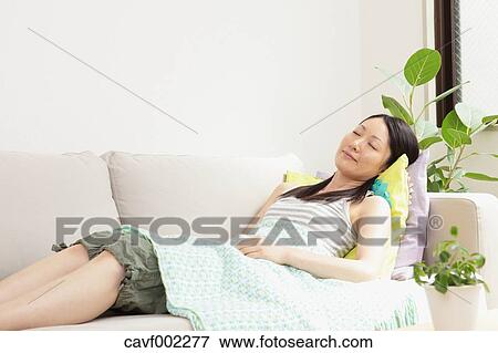 Woman sleeping on the sofa View Large Photo Image Stock Photo - Woman sleeping on the sofa. Fotosearch