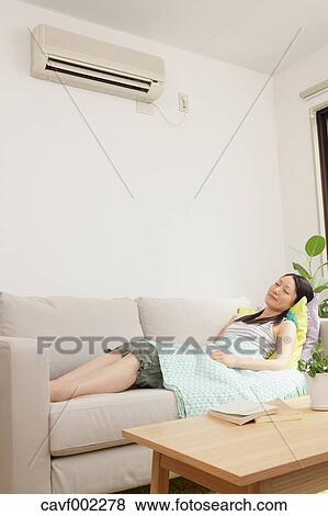 Woman sleeping on the sofa View Large Photo Image Stock Photo - Woman sleeping on the sofa. Fotosearch