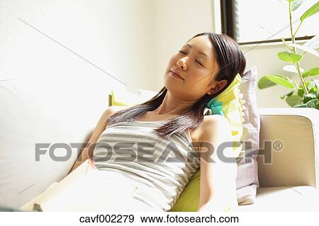 Woman sleeping on the sofa View Large Photo Image Stock Photo - Woman sleeping on the sofa. Fotosearch